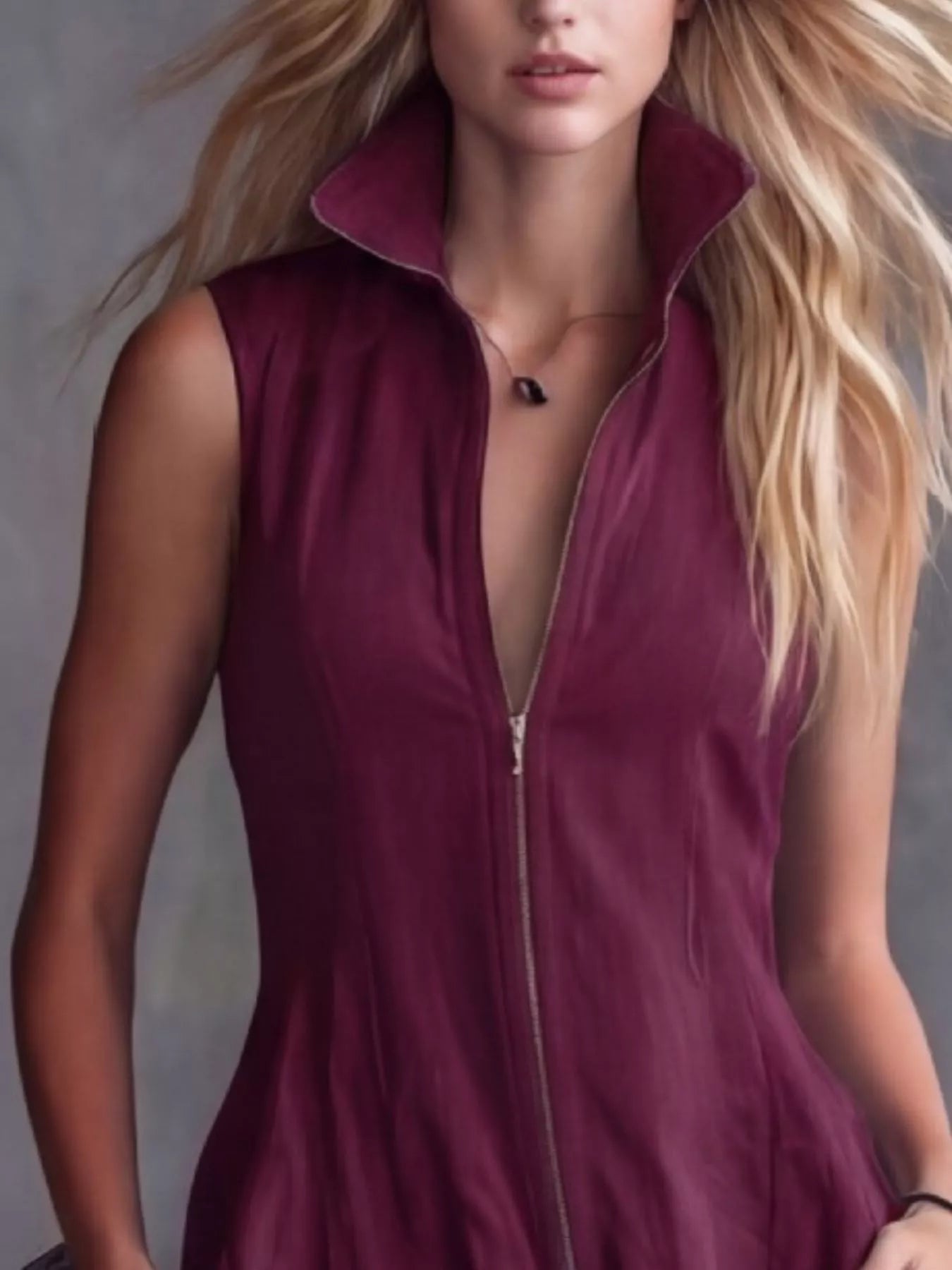 Women's burgundy high-low ruffled sleeveless maxi dress featuring a zip-front closure. Elegant boutique dress perfect for fall festivals, winery weekends, date nights, and boho-inspired outfits.