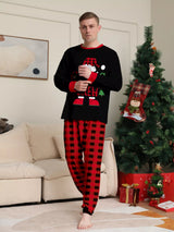 Dad modeling matching Christmas Crew pajama sets with festive black graphic tops and red and black plaid pants.