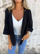 Women's Black open front 3/4 sleeve casual cardigan layered over a white V-neck tank with blue jeans, lightweight cardigan available in sizes Small–5XL.