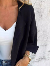 Women's Black open front 3/4 sleeve casual cardigan layered over a white V-neck tank with blue jeans, lightweight cardigan available in sizes Small–5XL.