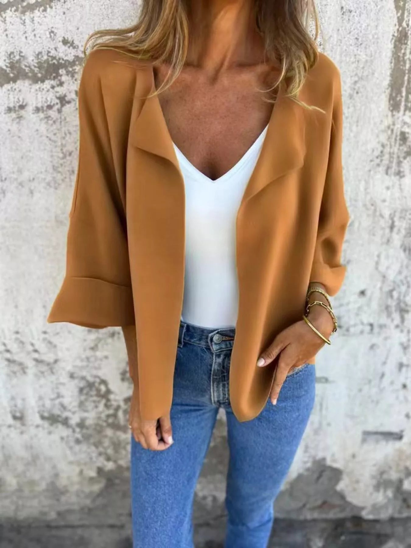 Women's Caramel open front 3/4 sleeve casual cardigan layered over a white V-neck tank with blue jeans, lightweight cardigan available in sizes Small–5XL.