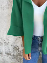 Women's Dark Green open front 3/4 sleeve casual cardigan layered over a white V-neck tank with blue jeans, lightweight cardigan available in sizes Small–5XL.