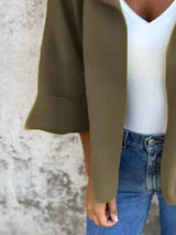 Women's Olive open front 3/4 sleeve casual cardigan layered over a white V-neck tank with blue jeans, lightweight cardigan available in sizes Small–5XL.