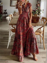 Women's paisley print tiered maxi dress with cap sleeves, smocked bodice, and flowing ruffle skirt, available in sizes Small–3XL, styled with sandals and a denim jacket for fall.