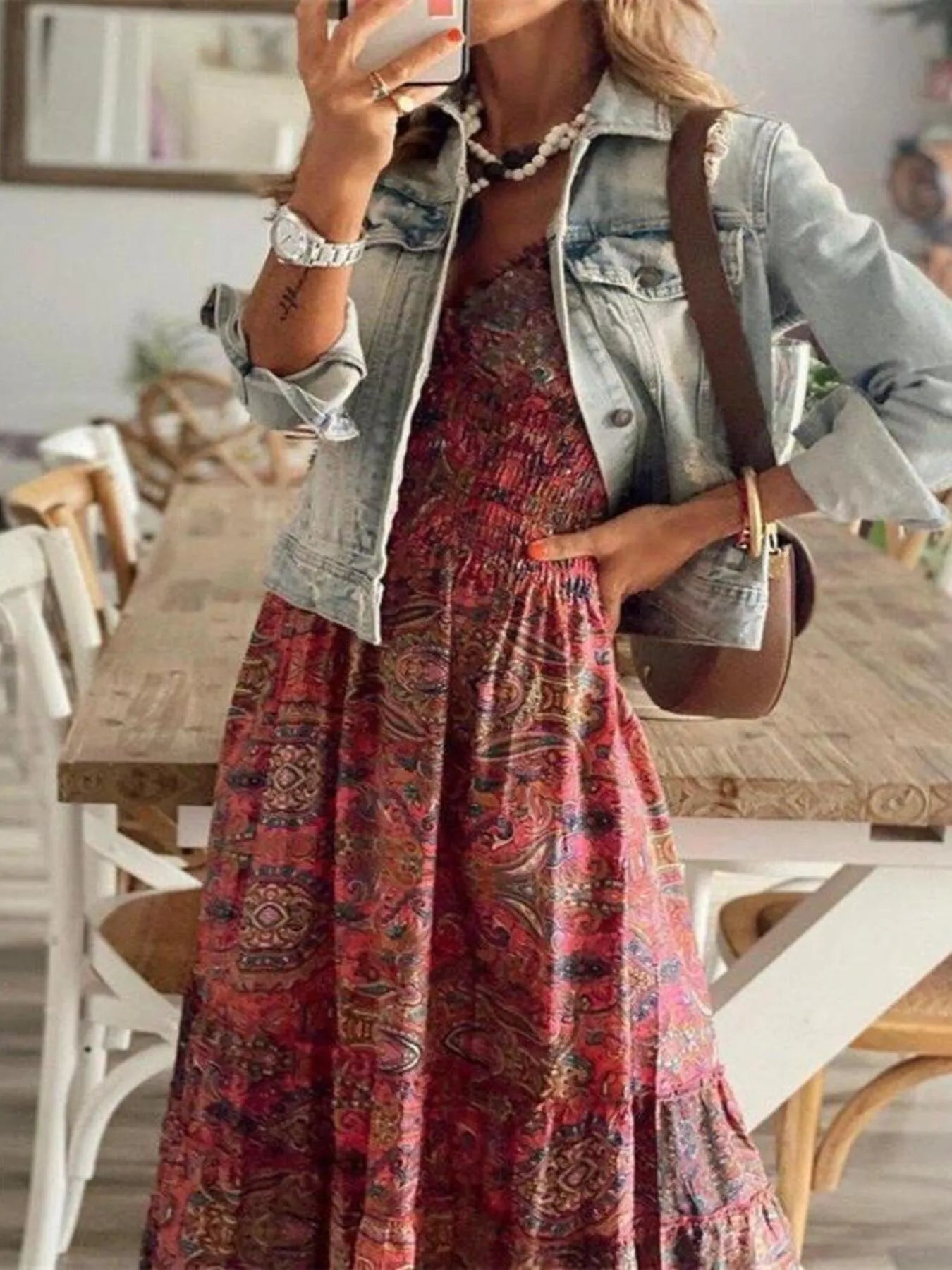 Women's paisley print tiered maxi dress with cap sleeves, smocked bodice, and flowing ruffle skirt, available in sizes Small–3XL, styled with sandals and a denim jacket for fall.