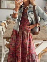 Women's paisley print tiered maxi dress with cap sleeves, smocked bodice, and flowing ruffle skirt, available in sizes Small–3XL, styled with sandals and a denim jacket for fall.