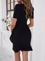 Women's plus size ruffle hem short sleeve dress with ruched waist in black, available in sizes Small–3XL, perfect for date nights, holiday parties, weddings, and elegant fall occasions.