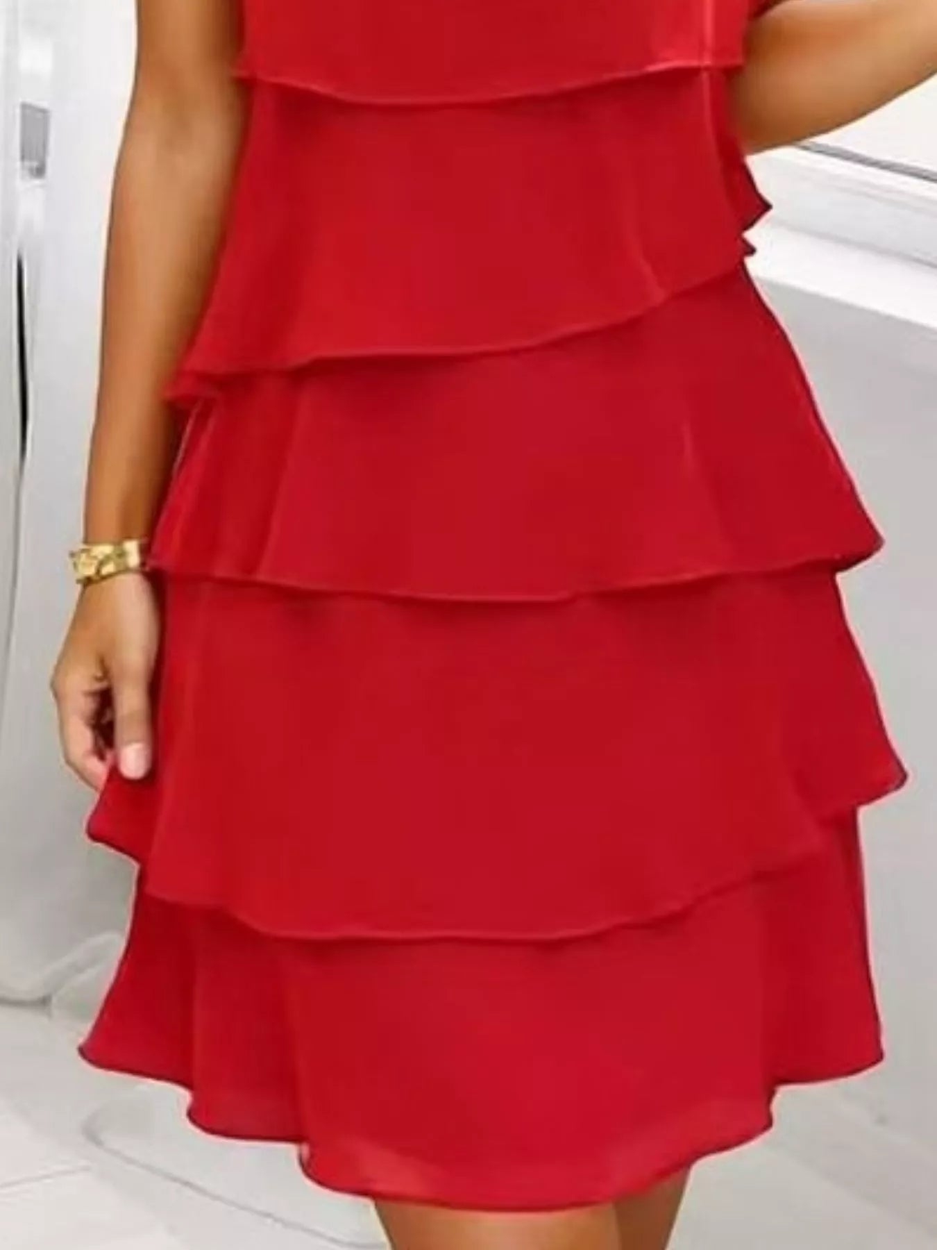 Scarlet tiered dress on a white background