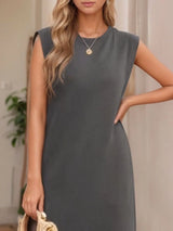 Women's dark gray sleeveless maxi tank dress with side pockets and side slit, casual round neck dress available in sizes Small–5XL, styled with white sandals.