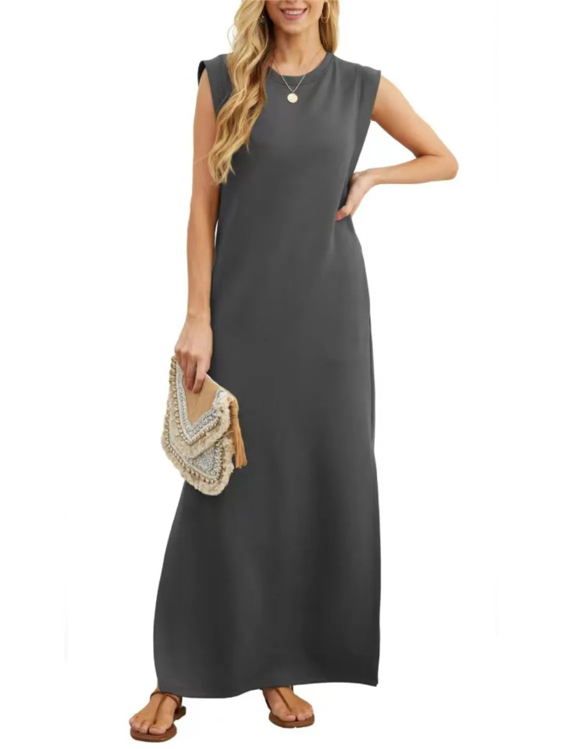 Women's dark gray sleeveless maxi tank dress with side pockets and side slit, casual round neck dress available in sizes Small–5XL, styled with white sandals.
