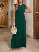 Women's dark green sleeveless maxi tank dress with side pockets and side slit, casual round neck dress available in sizes Small–5XL, styled with white sandals.