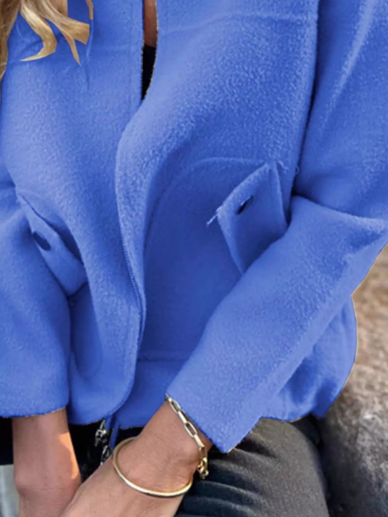 Women's blue textured knit zip-up outerwear jacket with decorative button pockets, lightweight fall jacket available in sizes Small–5XL, styled over a white tank and black jeans.