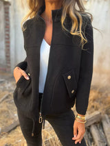Women's black textured knit zip-up outerwear jacket with decorative button pockets, lightweight fall jacket available in sizes Small–5XL, styled over a white tank and black jeans.