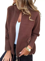 Women's brown textured knit zip-up outerwear jacket with decorative button pockets, lightweight fall jacket available in sizes Small–5XL, styled over a white tank and black jeans.