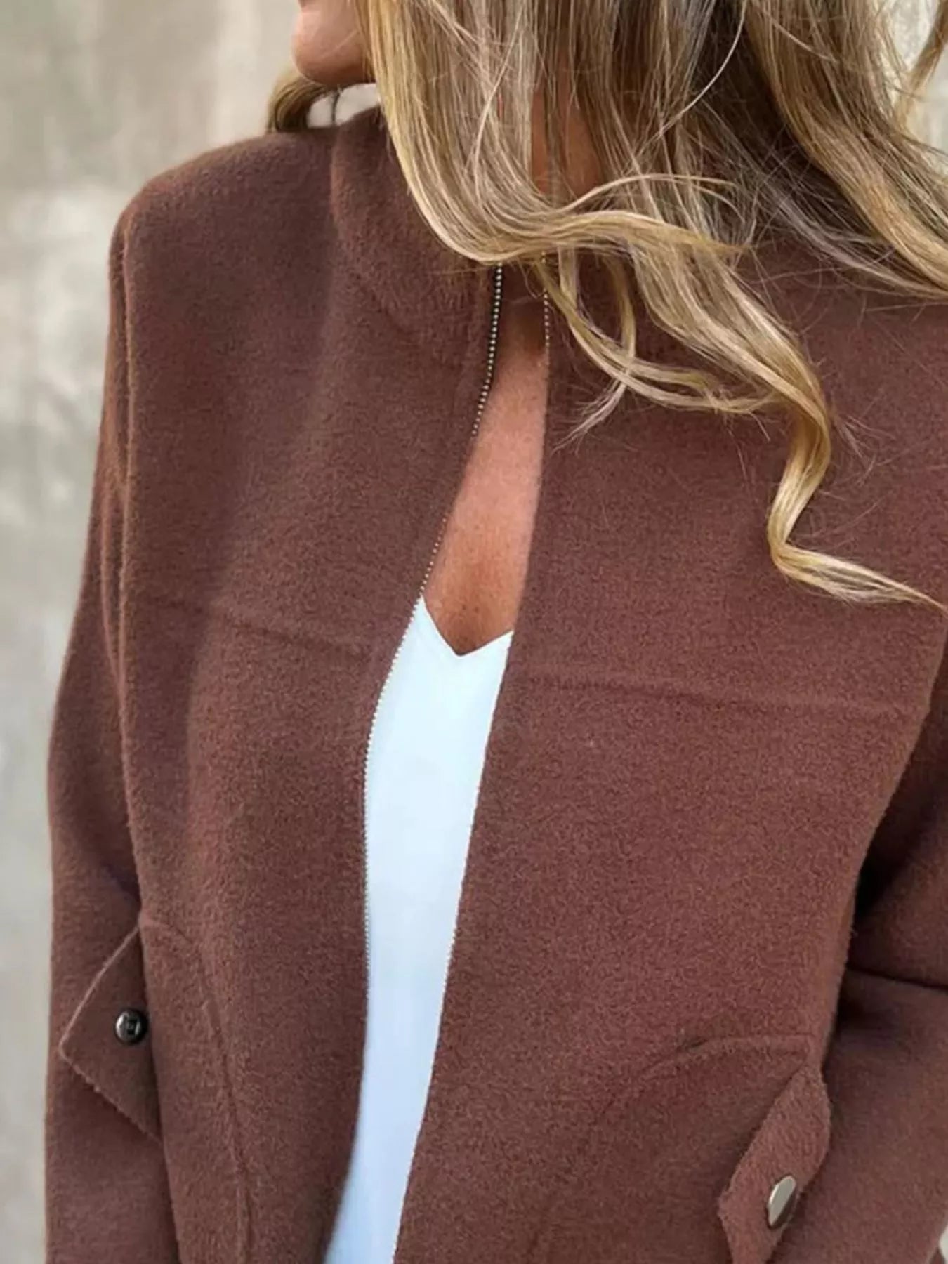 Women's brown textured knit zip-up outerwear jacket with decorative button pockets, lightweight fall jacket available in sizes Small–5XL, styled over a white tank and black jeans.