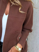 Women's brown textured knit zip-up outerwear jacket with decorative button pockets, lightweight fall jacket available in sizes Small–5XL, styled over a white tank and black jeans.
