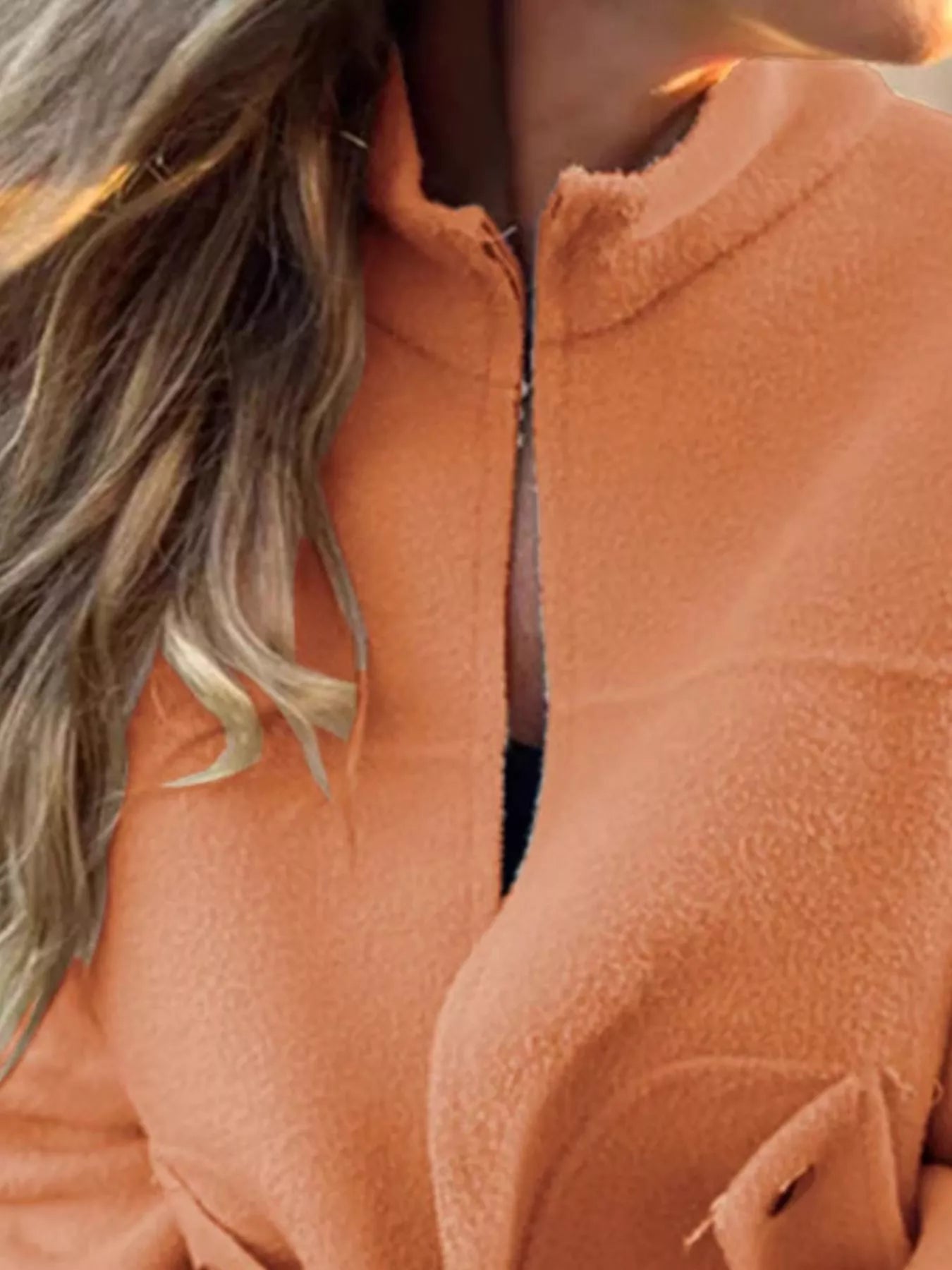 Women's orange textured knit zip-up outerwear jacket with decorative button pockets, lightweight fall jacket available in sizes Small–5XL, styled over a white tank and black jeans.