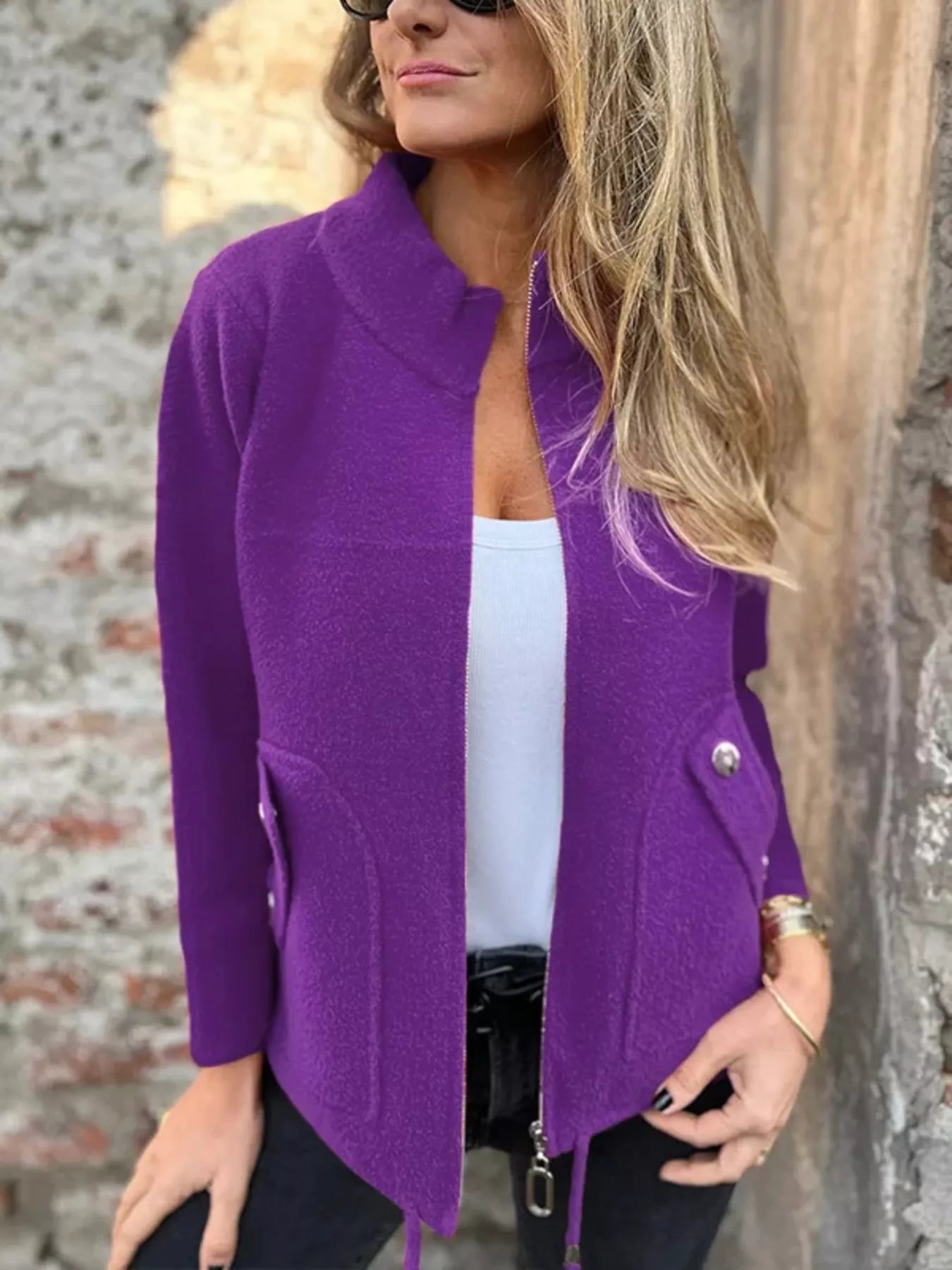 Women's purple textured knit zip-up outerwear jacket with decorative button pockets, lightweight fall jacket available in sizes Small–5XL, styled over a white tank and black jeans.