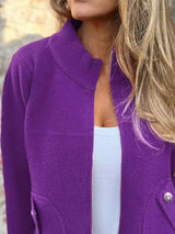 Women's purple textured knit zip-up outerwear jacket with decorative button pockets, lightweight fall jacket available in sizes Small–5XL, styled over a white tank and black jeans.