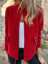 Women's red textured knit zip-up outerwear jacket with decorative button pockets, lightweight fall jacket available in sizes Small–5XL, styled over a white tank and black jeans.