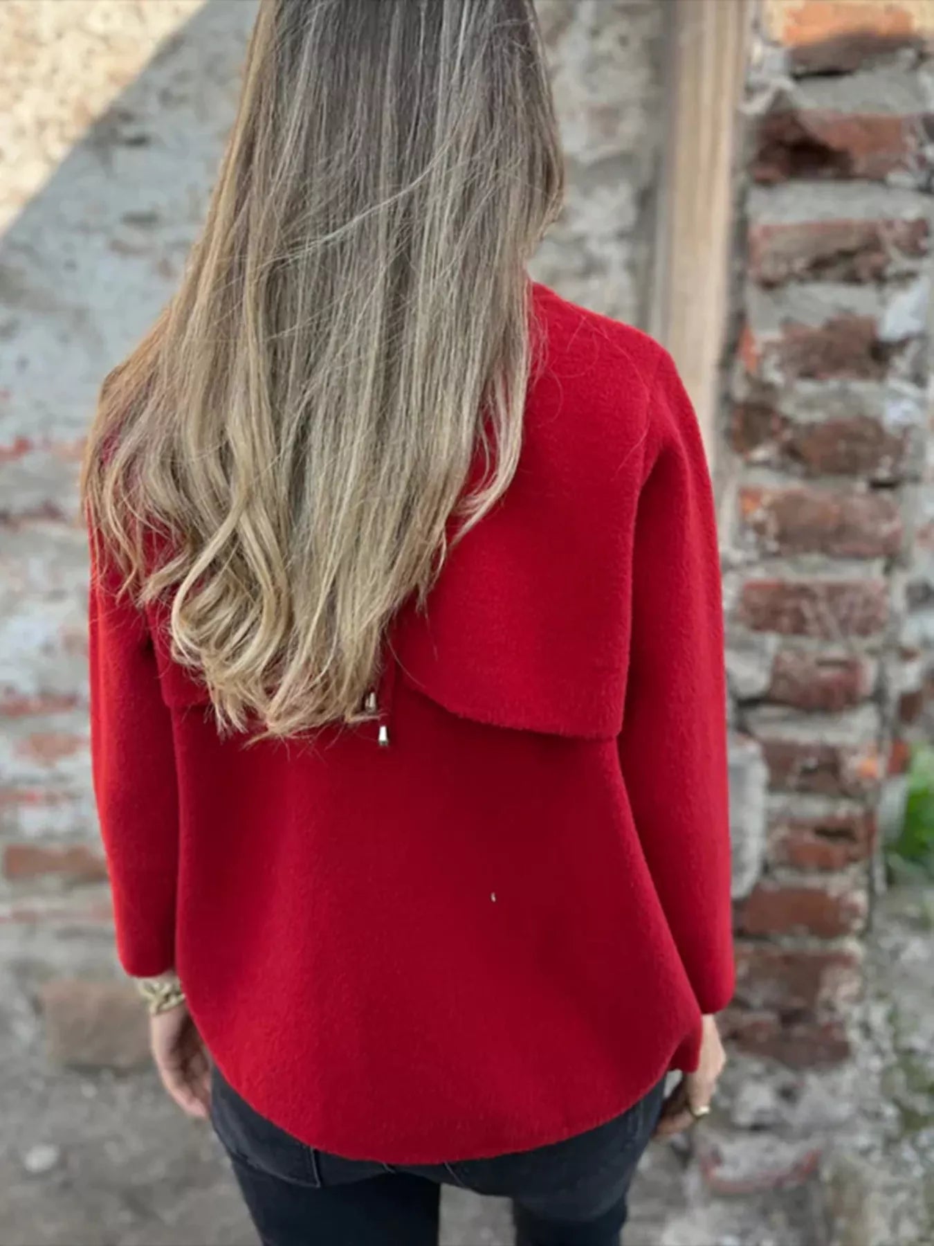 Women's red textured knit zip-up outerwear jacket with decorative button pockets, lightweight fall jacket available in sizes Small–5XL, styled over a white tank and black jeans.