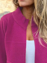 Women's rose red textured knit zip-up outerwear jacket with decorative button pockets, lightweight fall jacket available in sizes Small–5XL, styled over a white tank and black jeans.