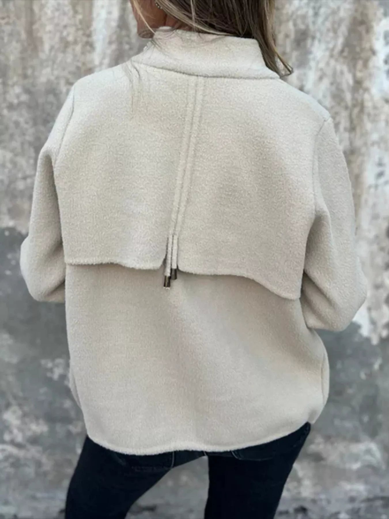 Women's white textured knit zip-up outerwear jacket with decorative button pockets, lightweight fall jacket available in sizes Small–5XL, styled over a white tank and black jeans.