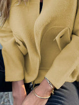 Women's yellow green textured knit zip-up outerwear jacket with decorative button pockets, lightweight fall jacket available in sizes Small–5XL, styled over a white tank and black jeans.