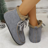 Women’s suede lace-up flat ankle boots with cozy fluffy trim in gray.