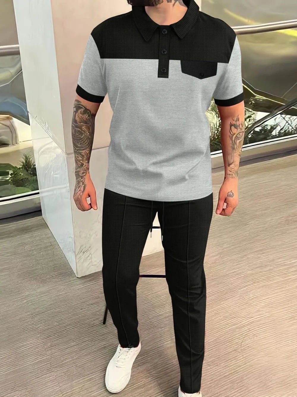 Men’s plus size gray and black waffle-knit contrast short sleeve top and pants set, available in sizes Small–3XL.