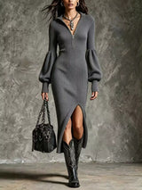 Woman wearing a gray ribbed knit quarter-zip sweater dress with long lantern sleeves, front slit and black embroidered western boots.