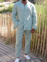 Men’s gum leaf button up long sleeve top and matching pants two-piece set styled with white sneakers, available in sizes Small–2XL.