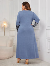 Woman wearing the Honey Plus Size Printed Long Sleeve Maxi Dress in blue with a Nordic-inspired print across the neckline and sleeves, cozy plus size fall maxi dress from Chic Mystik Boutique.