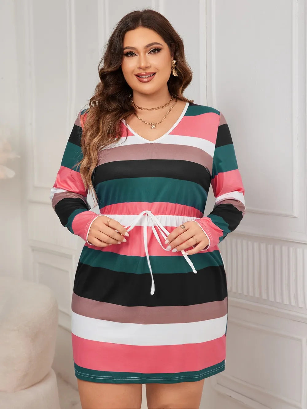 Women's plus size striped V-neck long sleeve mini dress with adjustable drawstring waist in pink, green, black, taupe, and white, available in sizes 1XL–4XL.