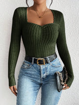 Woman wearing the Honey Ribbed Long Sleeve Sweetheart Neck Top in army green with light wash jeans and a black belt, stylish ribbed women's top from Chic Mystik Boutique.