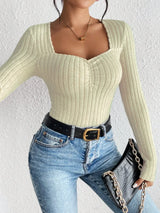 Woman wearing the Honey Ribbed Long Sleeve Sweetheart Neck Top in khaki with light wash jeans and a black belt, stylish ribbed women's top from Chic Mystik Boutique.