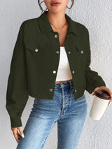 Woman wearing the Honey Snap Down Long Sleeve Jacket in army green with blue jeans and a white top, lightweight women's fall jacket from Chic Mystik Boutique.