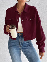 Woman wearing the Honey Snap Down Long Sleeve Jacket in burgundy with blue jeans and a white top, lightweight women's fall jacket from Chic Mystik Boutique.