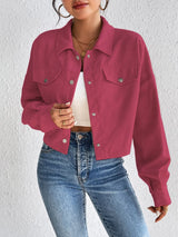 Woman wearing the Honey Snap Down Long Sleeve Jacket in cerise with blue jeans and a white top, lightweight women's fall jacket from Chic Mystik Boutique.
