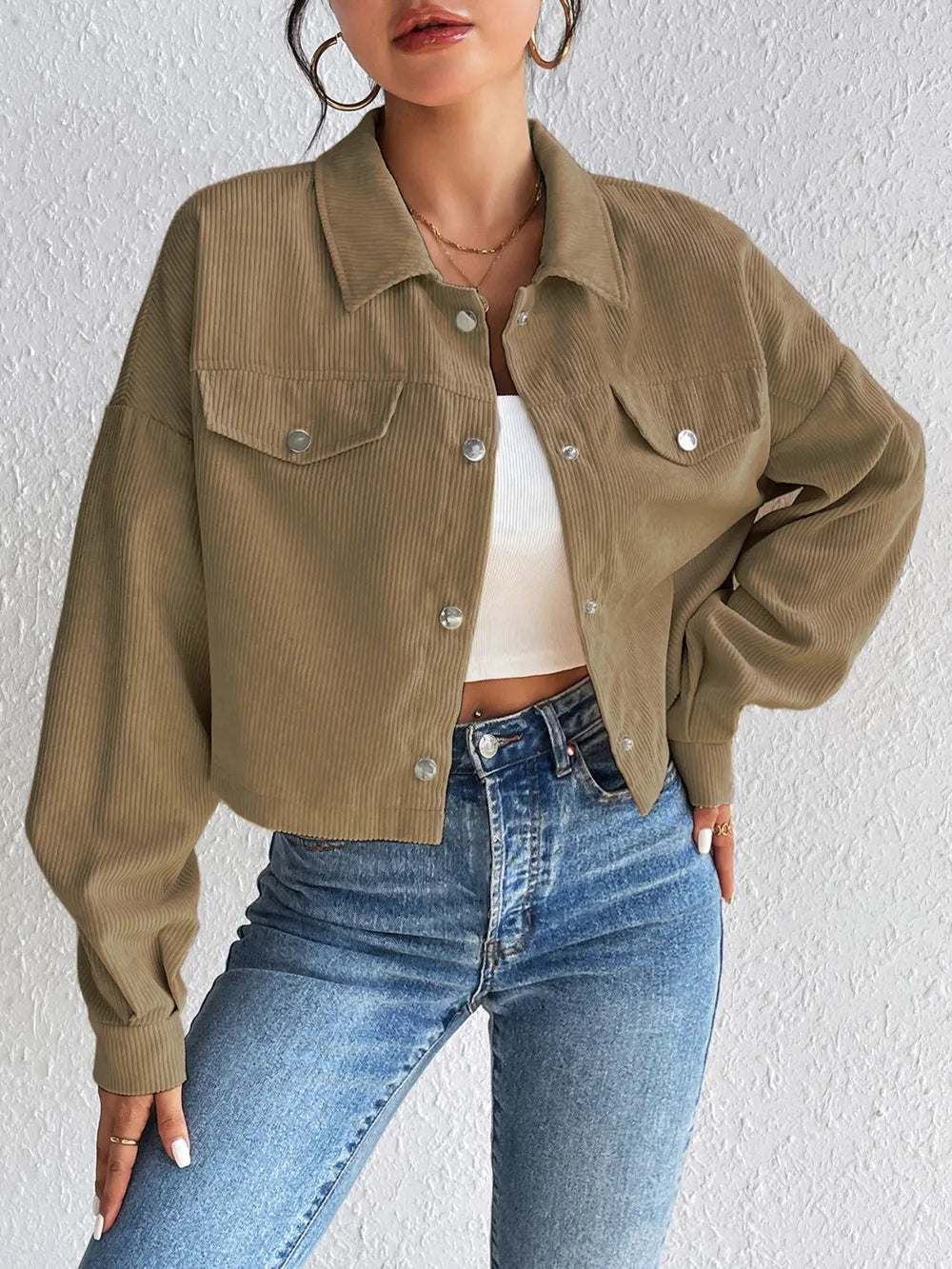 Woman wearing the Honey Snap Down Long Sleeve Jacket in taupe with blue jeans and a white top, lightweight women's fall jacket from Chic Mystik Boutique.