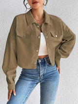 Woman wearing the Honey Snap Down Long Sleeve Jacket in taupe with blue jeans and a white top, lightweight women's fall jacket from Chic Mystik Boutique.