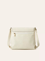 Ivory vintage-style crossbody bag featuring a flap closure, decorative buckle detail, and adjustable shoulder strap.