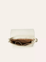 Open ivory crossbody bag with multiple interior compartments and zippered pockets for organization.