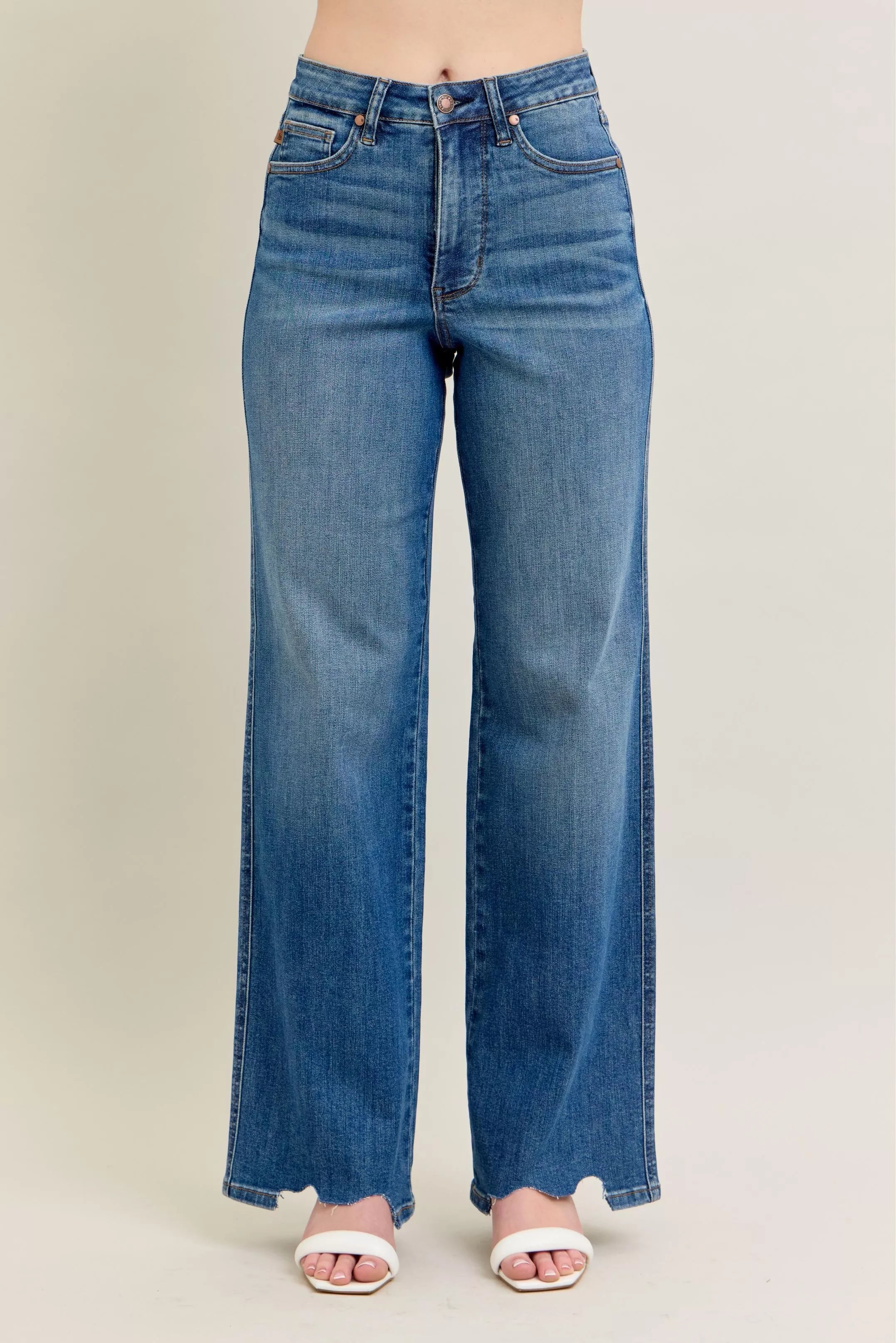 Judy Blue Full Size High Waist Tummy Control Chew Hem Destroy Wide Jeans in medium wash featuring a flattering high-rise fit, wide-leg silhouette, distressed details, raw chew hem, and slightly stretchy denim.  