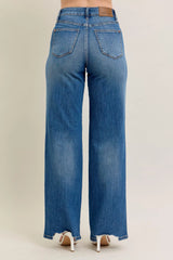 Judy Blue Full Size High Waist Tummy Control Chew Hem Destroy Wide Jeans in medium wash featuring a flattering high-rise fit, wide-leg silhouette, distressed details, raw chew hem, and slightly stretchy denim.