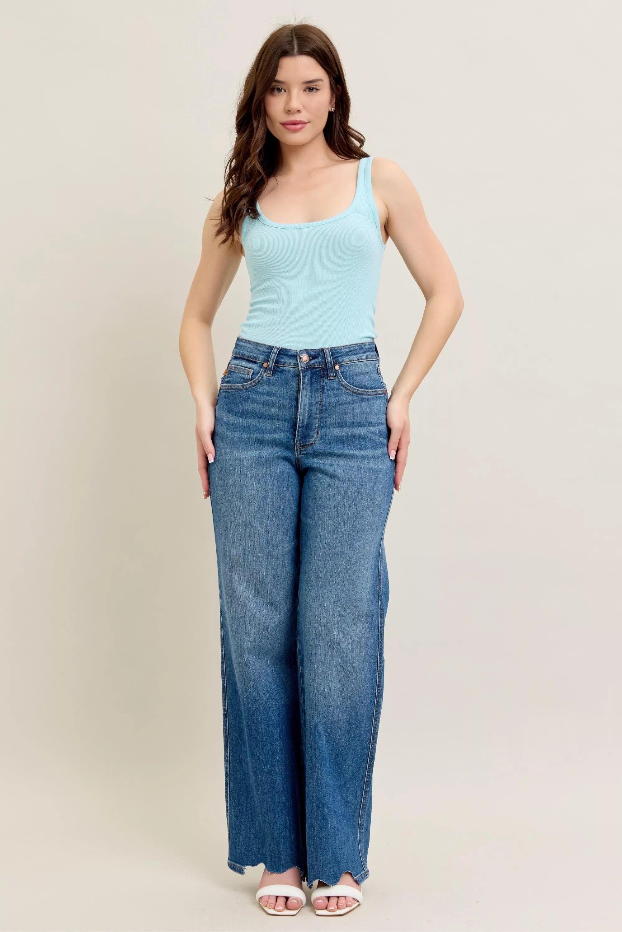 Judy Blue Full Size High Waist Tummy Control Chew Hem Destroy Wide Jeans in medium wash featuring a flattering high-rise fit, wide-leg silhouette, distressed details, raw chew hem, and slightly stretchy denim.