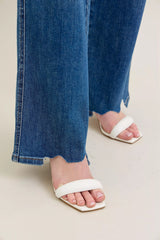 Judy Blue Full Size High Waist Tummy Control Chew Hem Destroy Wide Jeans in medium wash featuring a flattering high-rise fit, wide-leg silhouette, distressed details, raw chew hem, and slightly stretchy denim.
