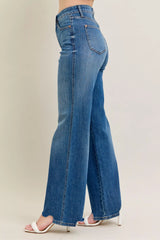 Judy Blue Full Size High Waist Tummy Control Chew Hem Destroy Wide Jeans in medium wash featuring a flattering high-rise fit, wide-leg silhouette, distressed details, raw chew hem, and slightly stretchy denim.