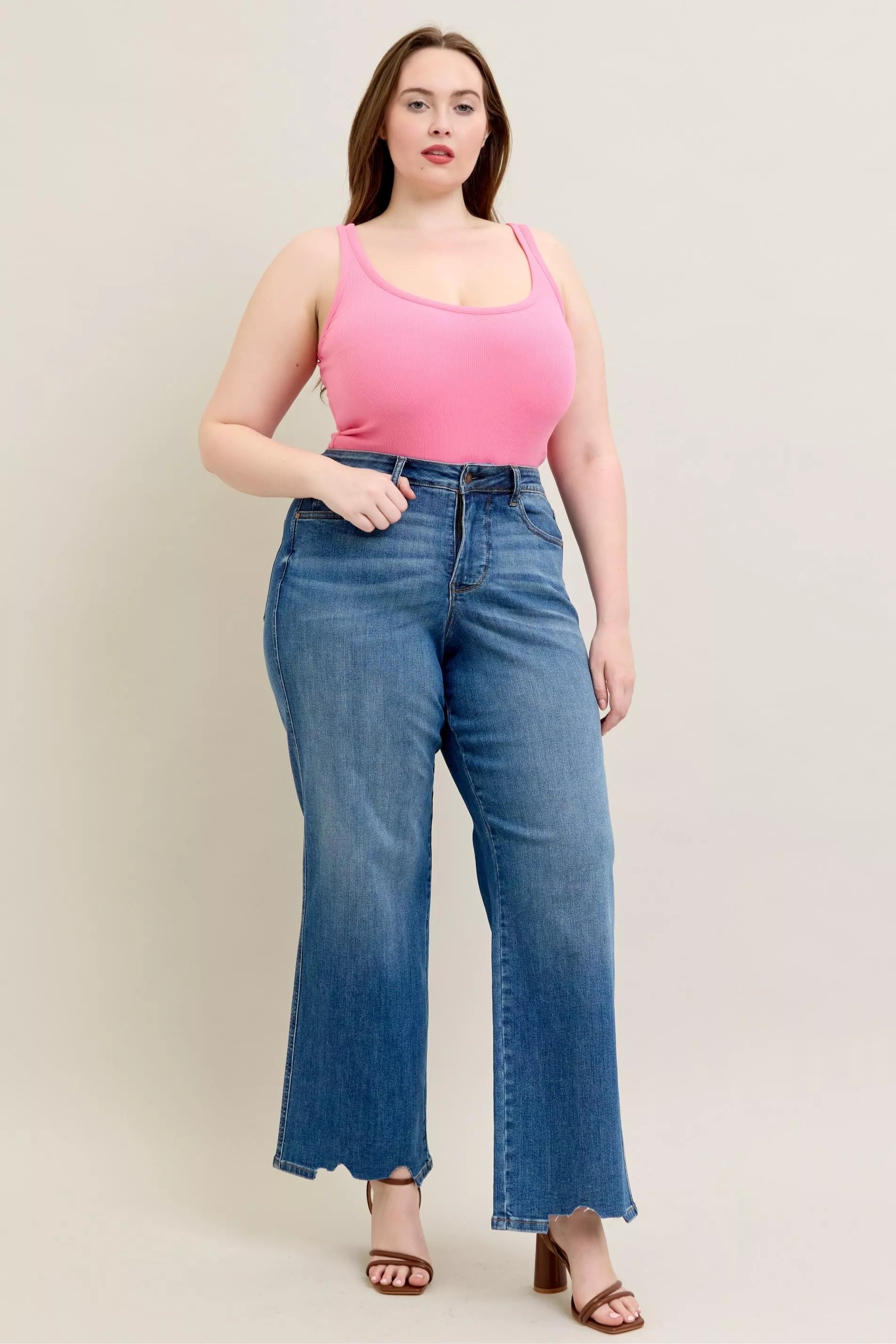 Judy Blue Full Size High Waist Tummy Control Chew Hem Destroy Wide Jeans in medium wash featuring a flattering high-rise fit, wide-leg silhouette, distressed details, raw chew hem, and slightly stretchy denim.