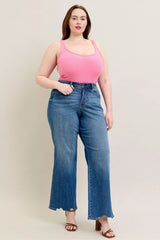 Judy Blue Full Size High Waist Tummy Control Chew Hem Destroy Wide Jeans in medium wash featuring a flattering high-rise fit, wide-leg silhouette, distressed details, raw chew hem, and slightly stretchy denim.